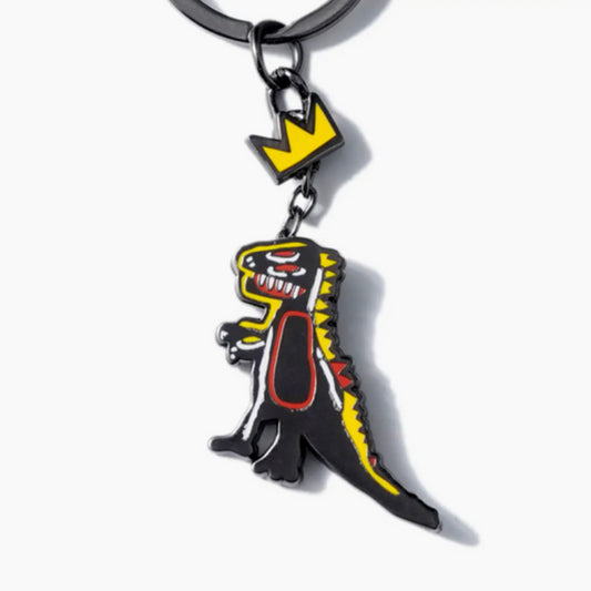 Porte-clés Basquiat dinosaure couronné – Collaboration Pintrill – Métal émaillé noir et jaune