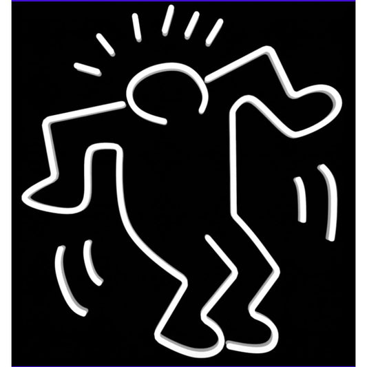 Néon mural Dancing Man blanc – Keith Haring x Yellow Pop, allumé dans une pièce cosy