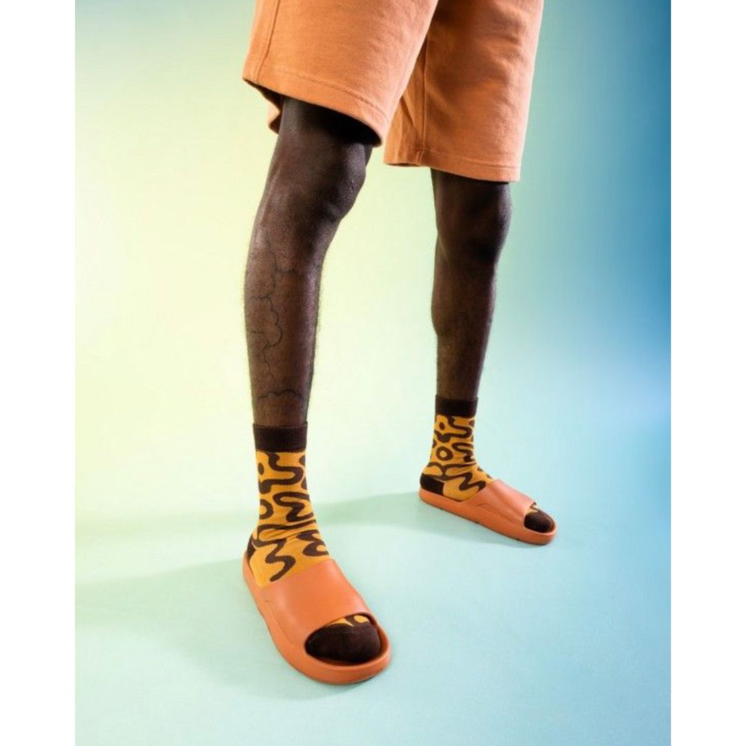 Chaussettes Eat My Socks – modèle Éclair au chocolat, packaging pâtisserie