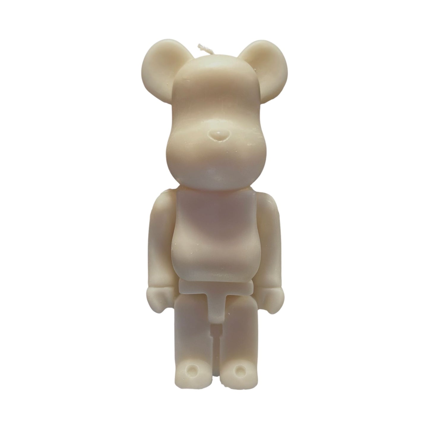 Bougie ivoire en forme de figurine Bearbrick stylisée, inspirée du design pop