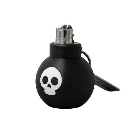 Briquet Boum Superstuff noir en forme de bombe avec tête de mort blanche